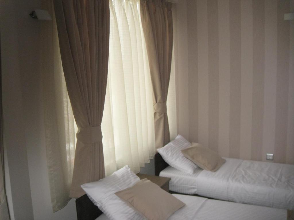 Domus Aparthotel Skopje Rum bild